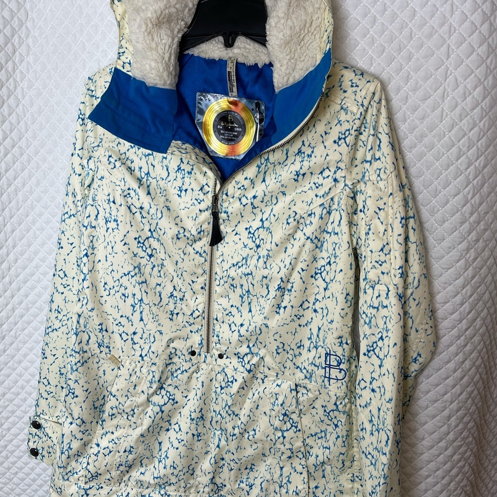 Burton medium-weight Dry Ride Snowboarding jacket. It’s dope.